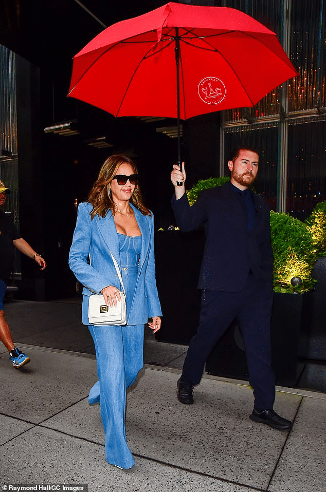 Jessica Alba Turns Heads in Denim Bustier Top and Owns the Rain with Umbrella Handler in NYC