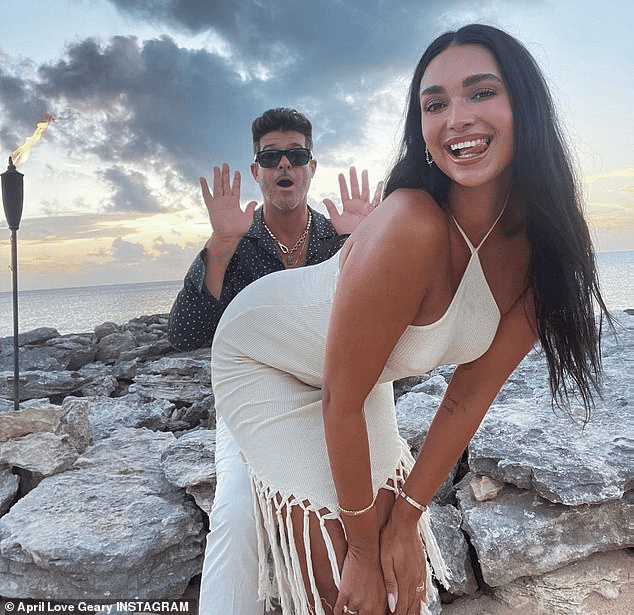 April Love Geary Stuns in Low-Cut Bikini as Fiance Robin Thicke Captures Ocean Romp